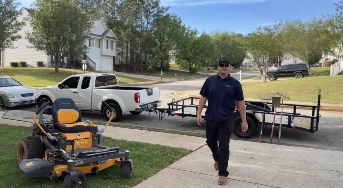 James — Owner of Lawn To The Max — with mower, truck and trailer